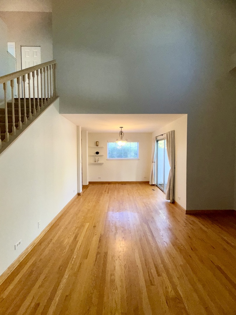 1198 Bristol Lane Buffalo Grove, IL 60089 - Photo 13 of 24 a view of a room with wooden floor