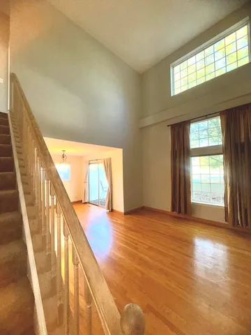 a view of an empty room with glass door