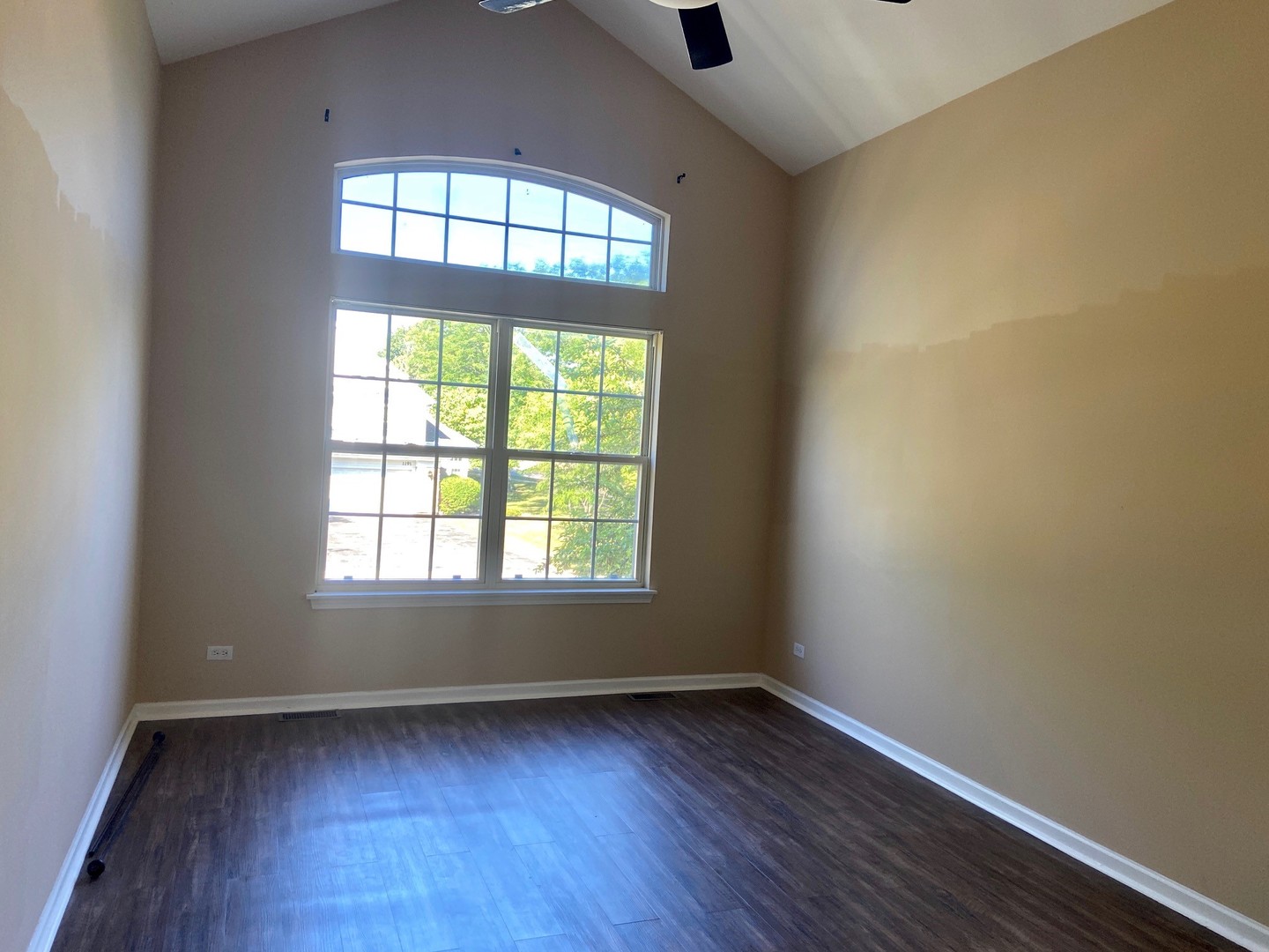 1198 Bristol Lane Buffalo Grove, IL 60089 - Photo 18 of 24 an empty room with wooden floor and windows