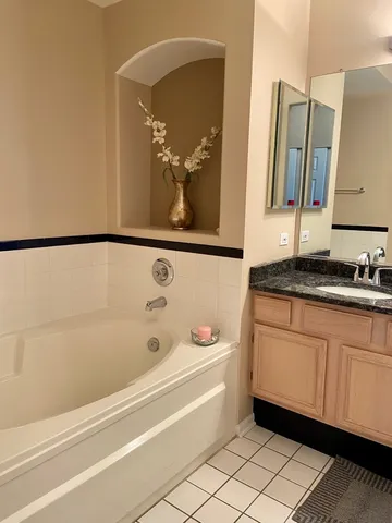 a bathroom with a bathtub and a sink