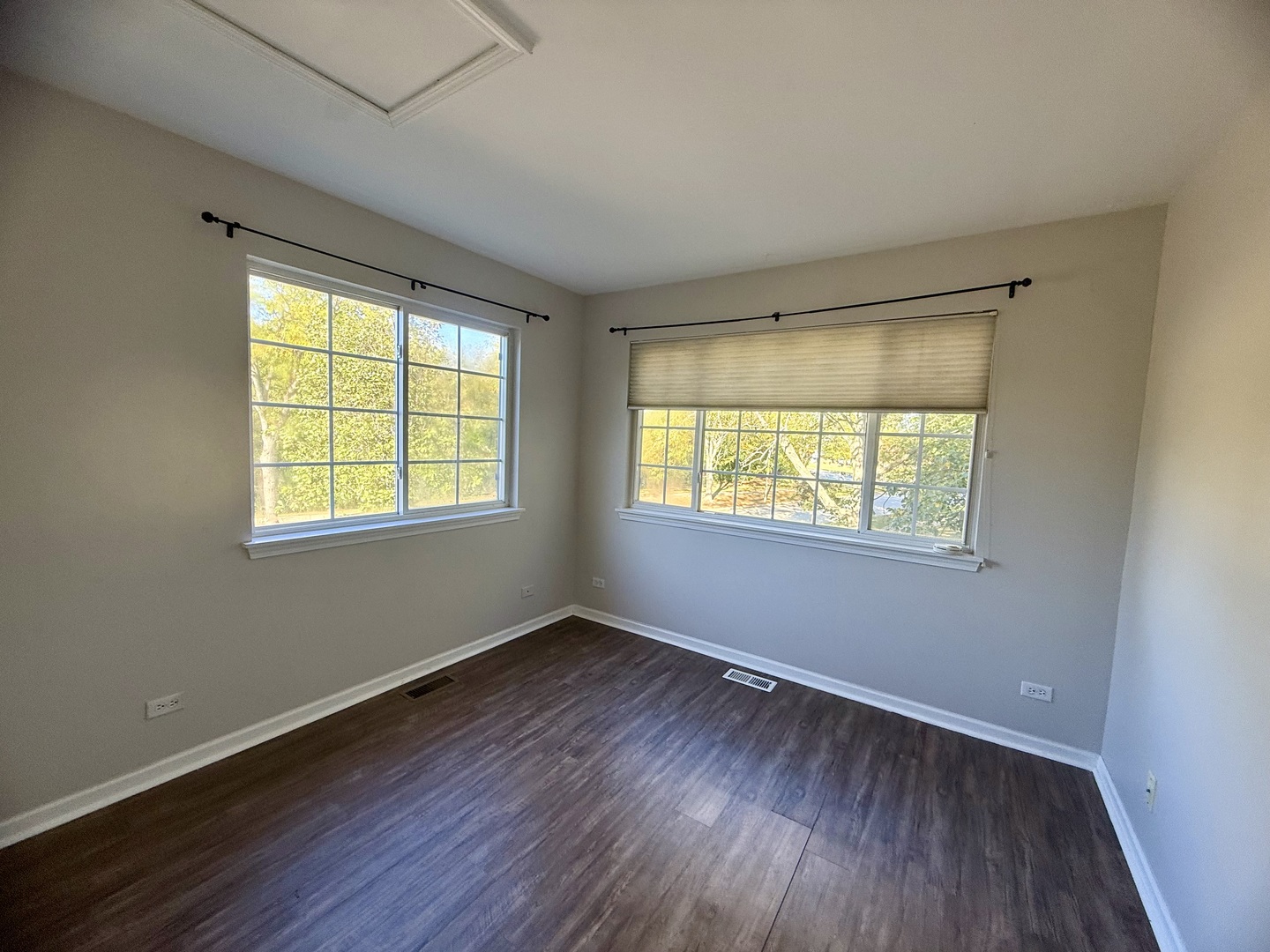 1198 Bristol Lane Buffalo Grove, IL 60089 - Photo 22 of 24 a view of an empty room with wooden floor and a window