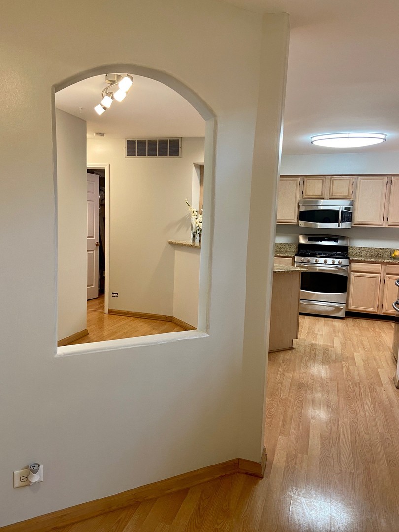 1198 Bristol Lane Buffalo Grove, IL 60089 - Photo 7 of 24 a view of a kitchen with wooden floor