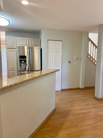 a view of a kitchen with a sink and cabinet