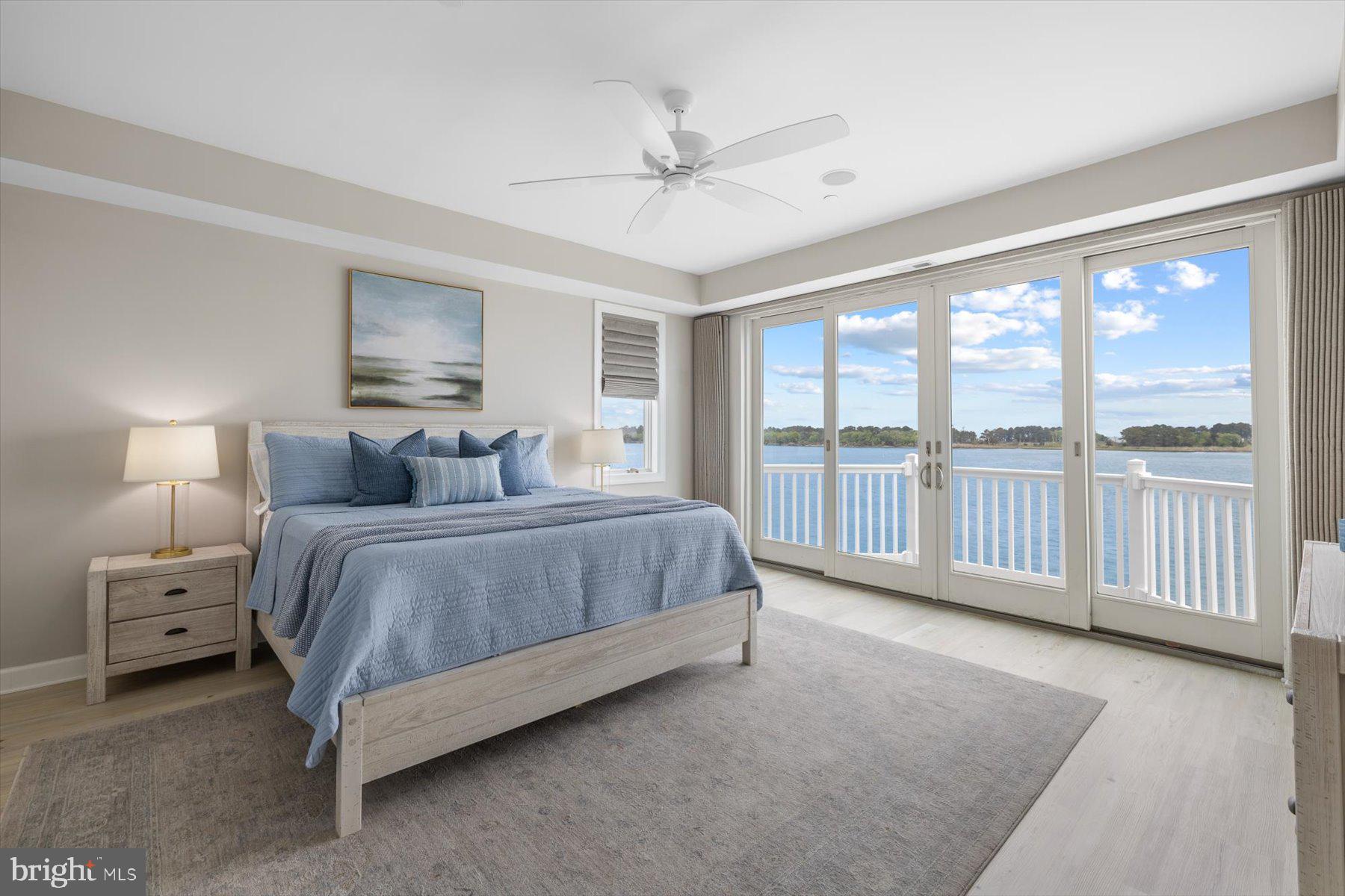 35 Inlet View Court Bethany Beach, DE 19930 - Photo 36 of 74 a spacious bedroom with a bed and a large window