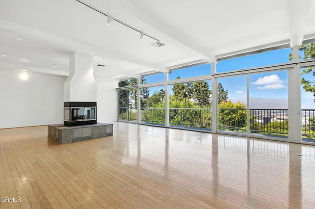 a view of a living room a window and a flat screen tv