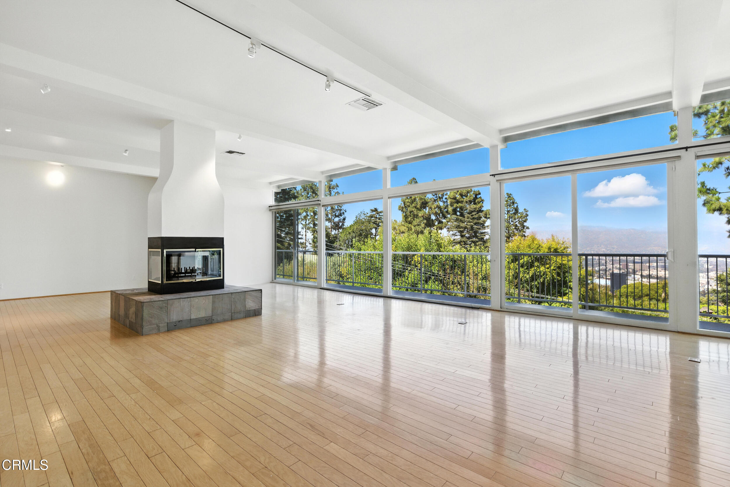 a view of a living room a window and a flat screen tv