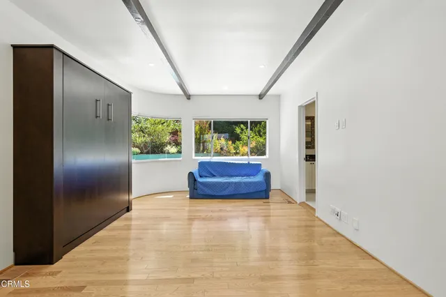 a large room with closet and window
