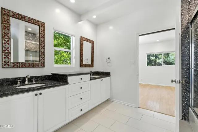 a kitchen with granite countertop a sink and a window