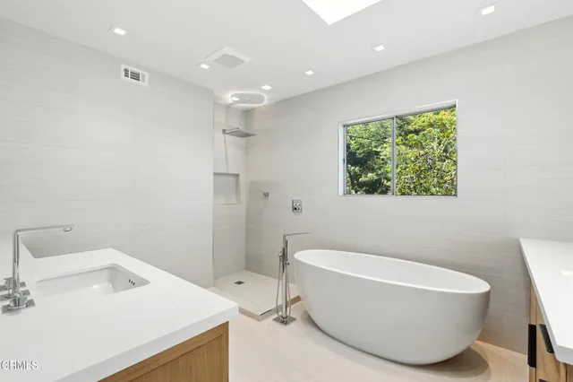 a bathroom with a sink and a bathtub