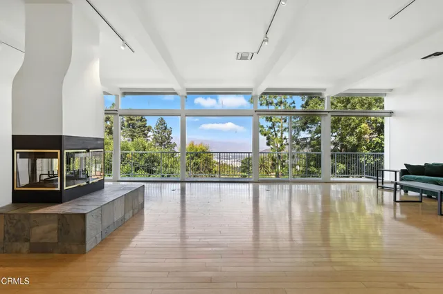 a view of a living room and a floor to ceiling window