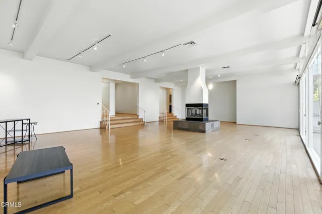 a view of kitchen with furniture and wooden floor
