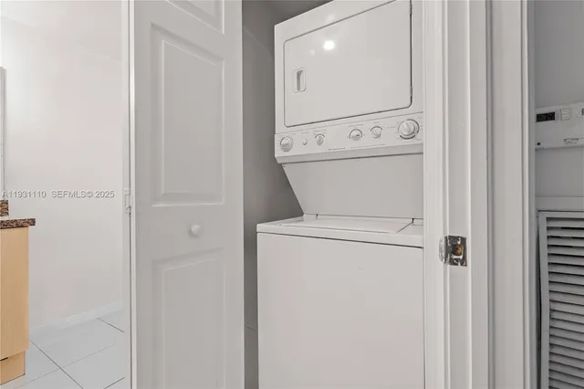 a view of bathroom with washer and dryer