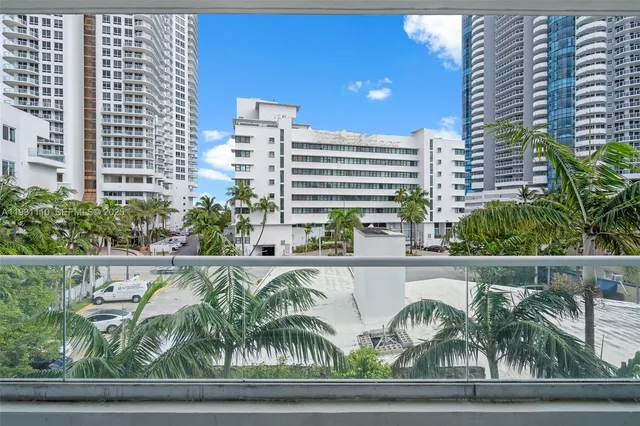 a view of a balcony with plants