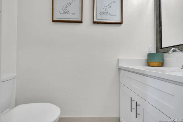 a bathroom with a toilet and a sink