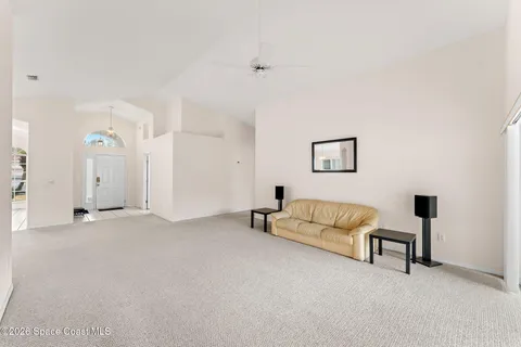 a view of livingroom with furniture and ceiling fan