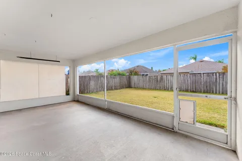 an aerial view of residential houses with outdoor space and lake view