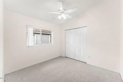 a bathroom with a tub a sink and mirror