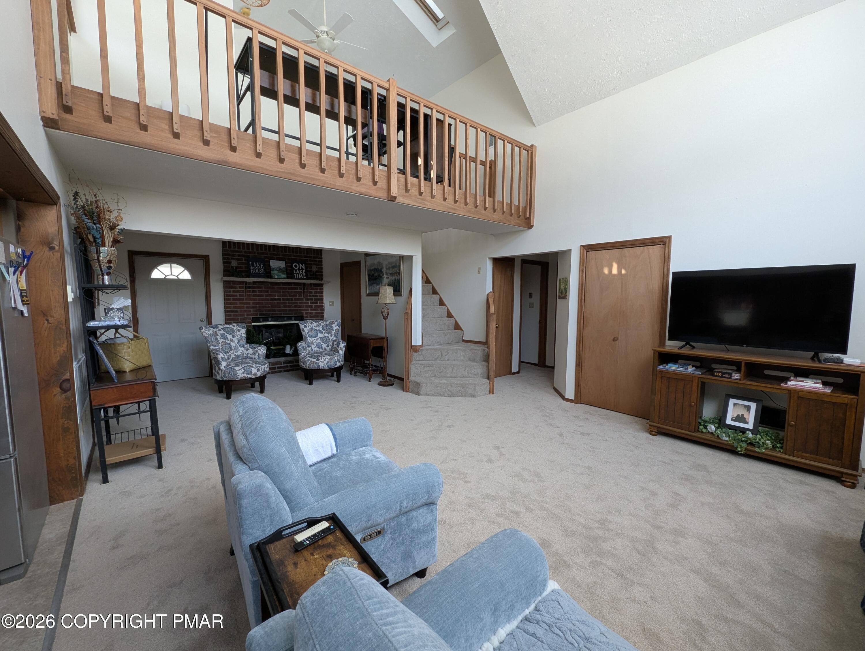 64 High Point Drive, Unit 2232 Lake Ariel, PA 18436 - Photo 12 of 12 a living room with furniture and a flat screen tv