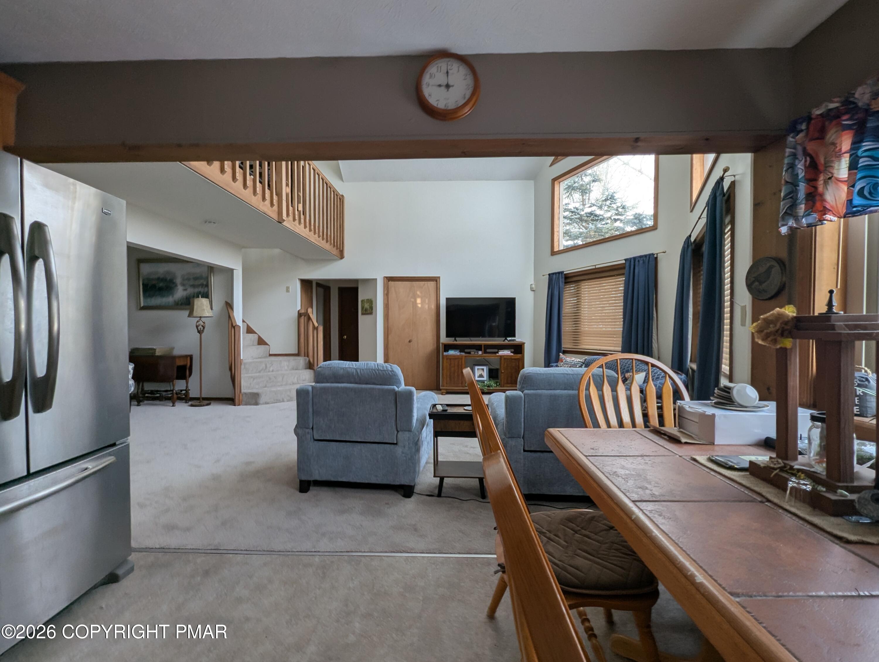 64 High Point Drive, Unit 2232 Lake Ariel, PA 18436 - Photo 5 of 12 a living room with furniture a flat screen tv and a window