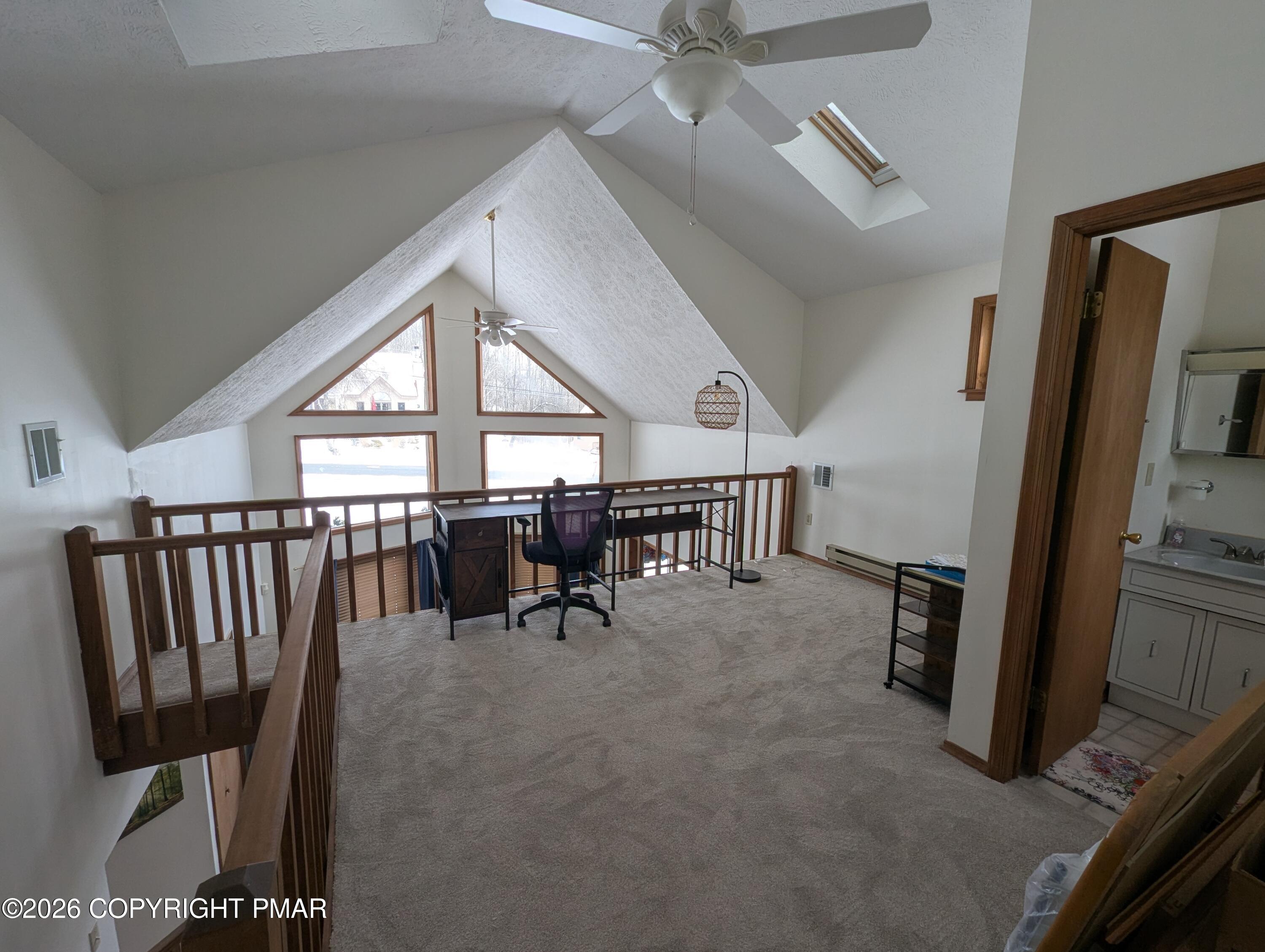 64 High Point Drive, Unit 2232 Lake Ariel, PA 18436 - Photo 8 of 12 a view of a hallway with furniture and a ceiling fan