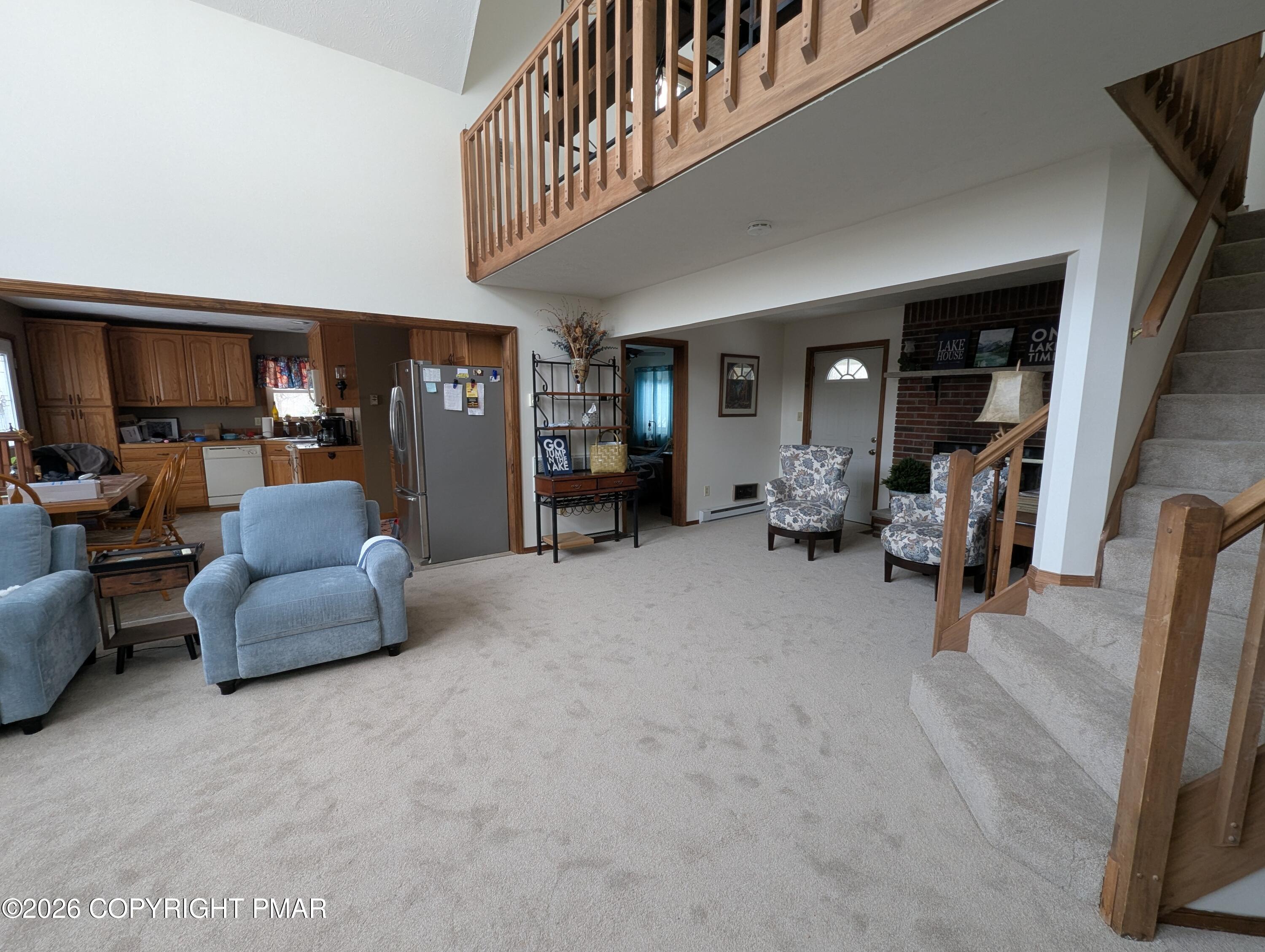 64 High Point Drive, Unit 2232 Lake Ariel, PA 18436 - Photo 9 of 12 a living room with furniture and a flat screen tv