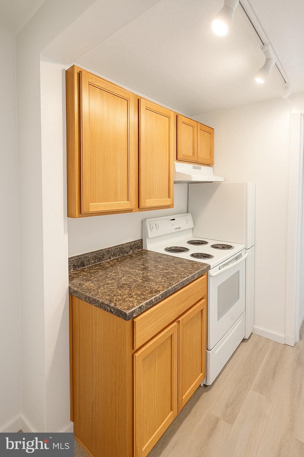 20 A W Bridge Street, Unit 20A New Hope, PA 18938 - Photo 3 of 7 a kitchen with a stove a sink and a refrigerator