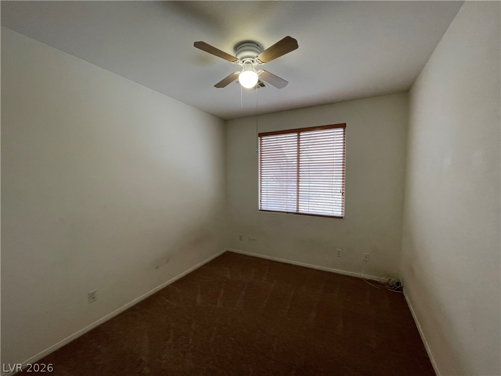 105 Parker Ranch Drive Henderson, NV 89012 - Photo 7 of 12 This cozy bedroom features comfortable flooring and a window offering natural light.