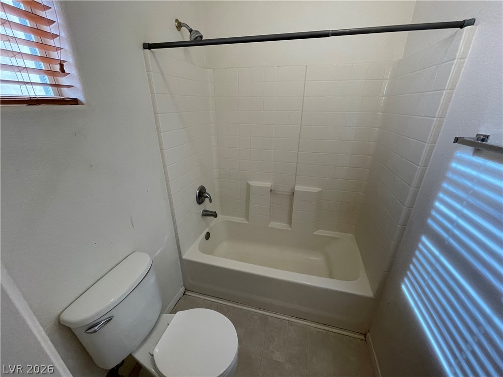 105 Parker Ranch Drive Henderson, NV 89012 - Photo 8 of 12 This bathroom features a functional tub and shower combination, offering practicality and convenience.