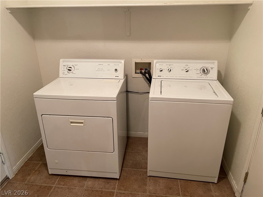 105 Parker Ranch Drive Henderson, NV 89012 - Photo 10 of 12 This dedicated laundry area offers convenient household utility with essential appliances.