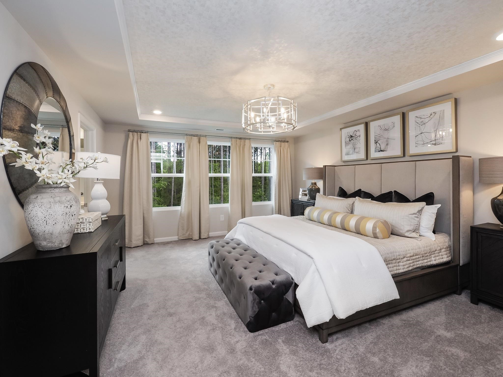 104 Sagebrook Drive, Unit 589 CHADWICK F Raleigh, NC 27610 - Photo 17 of 24 a spacious bedroom with a bed and dresser