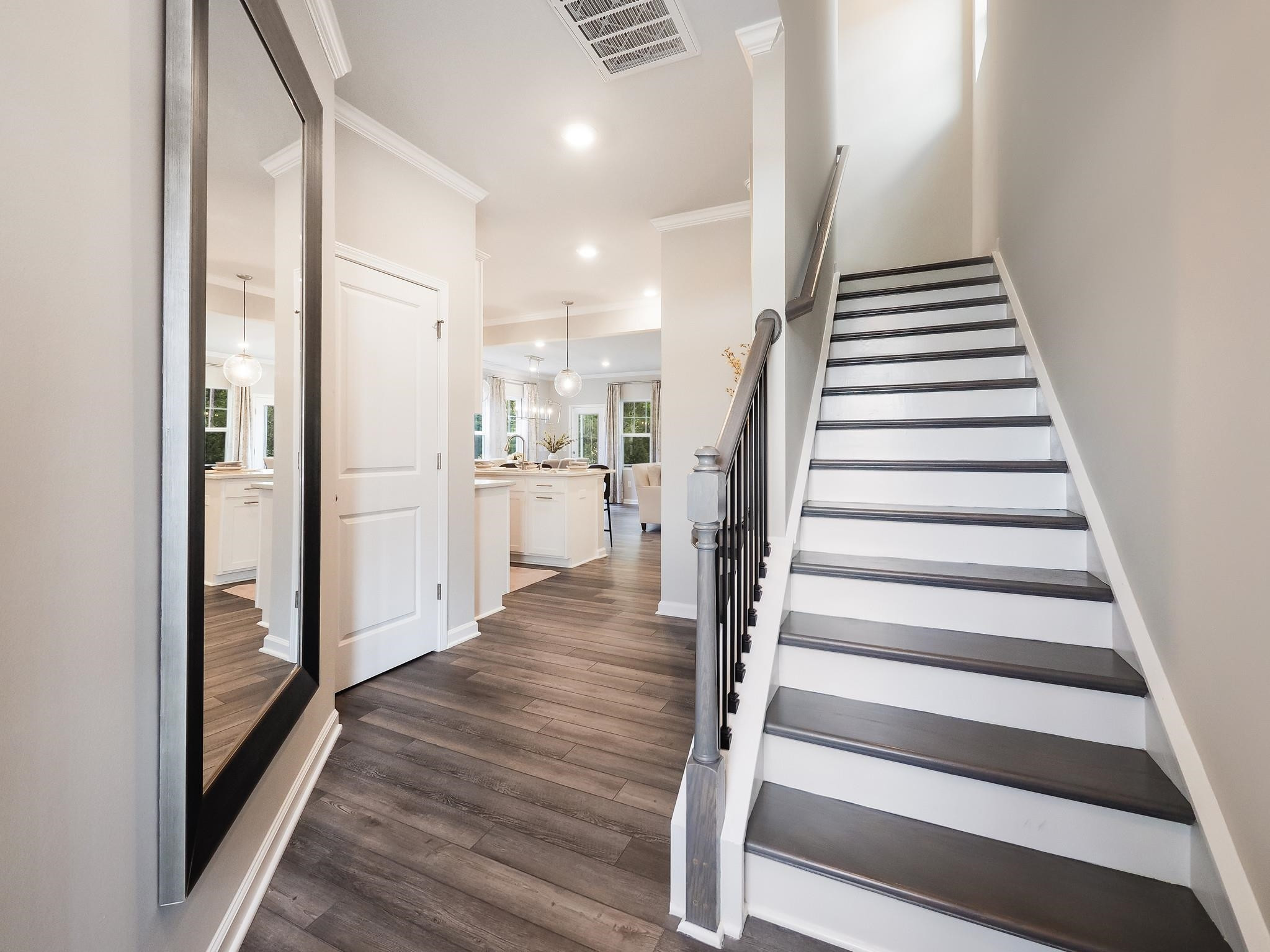 104 Sagebrook Drive, Unit 589 CHADWICK F Raleigh, NC 27610 - Photo 2 of 24 a view of entryway with wooden floor and stairs