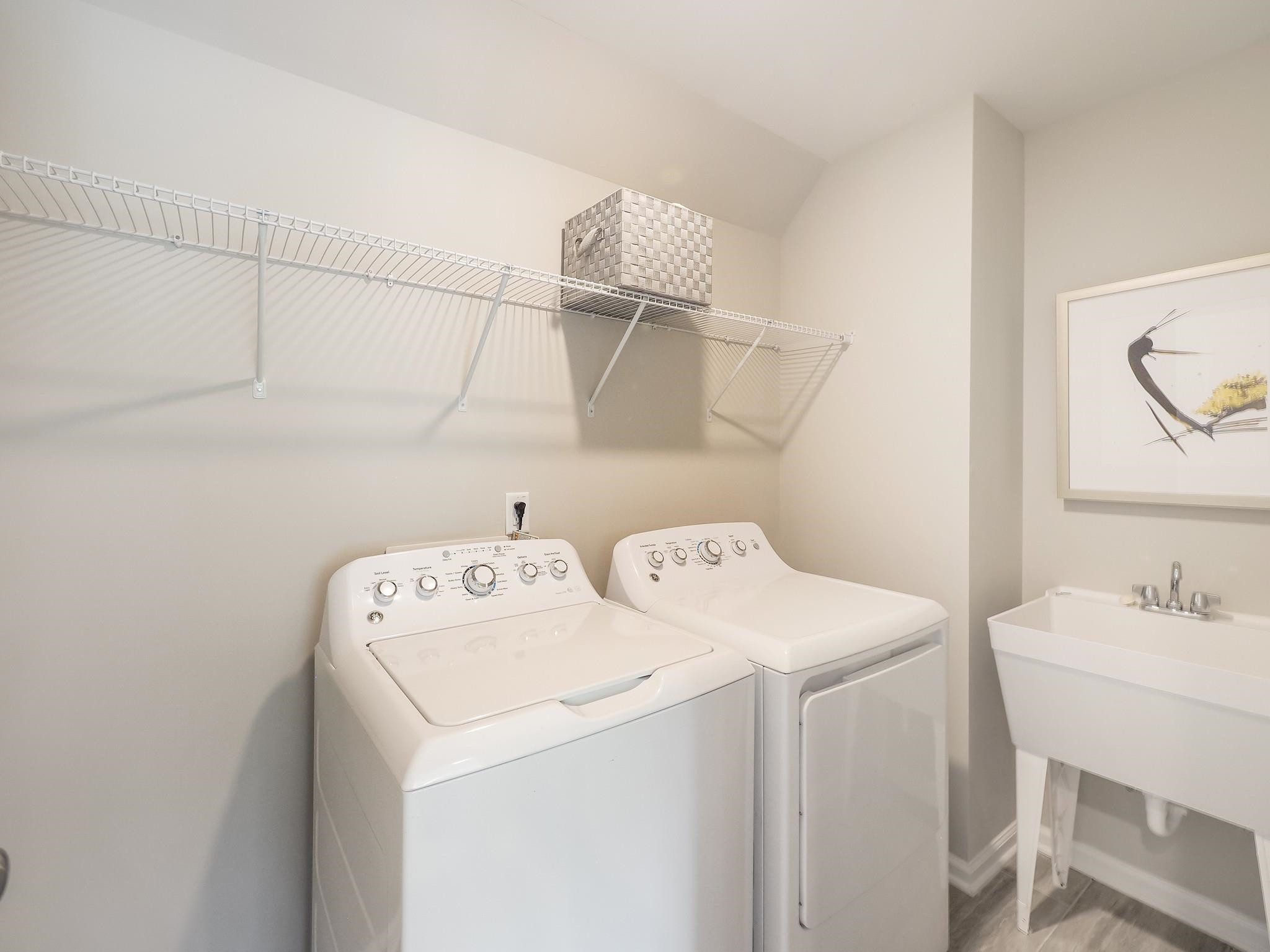 104 Sagebrook Drive, Unit 589 CHADWICK F Raleigh, NC 27610 - Photo 21 of 24 a utility room with dryer and washer