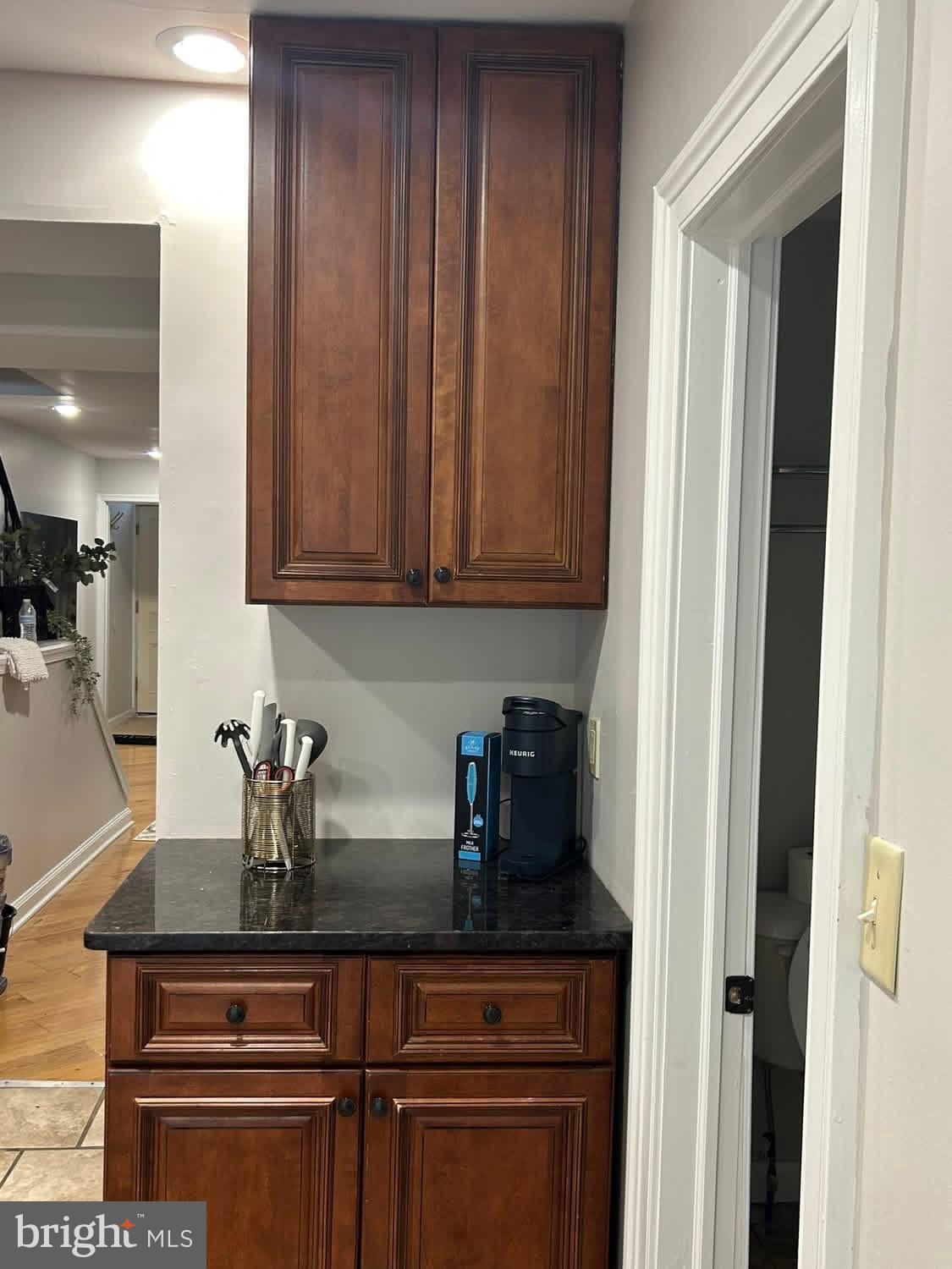 414 Durfor Street Philadelphia, PA 19148 - Photo 3 of 10 a kitchen with granite countertop wood cabinets and stainless steel appliances