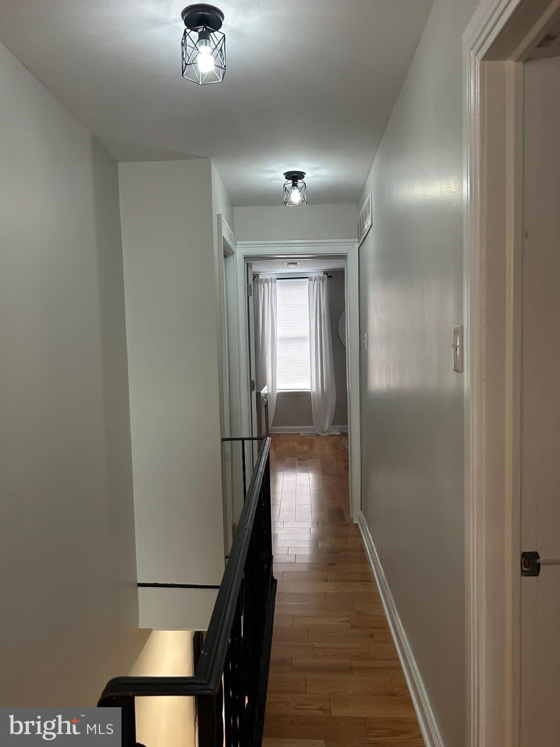 414 Durfor Street Philadelphia, PA 19148 - Photo 8 of 10 a view of a hallway with wooden floor and staircase