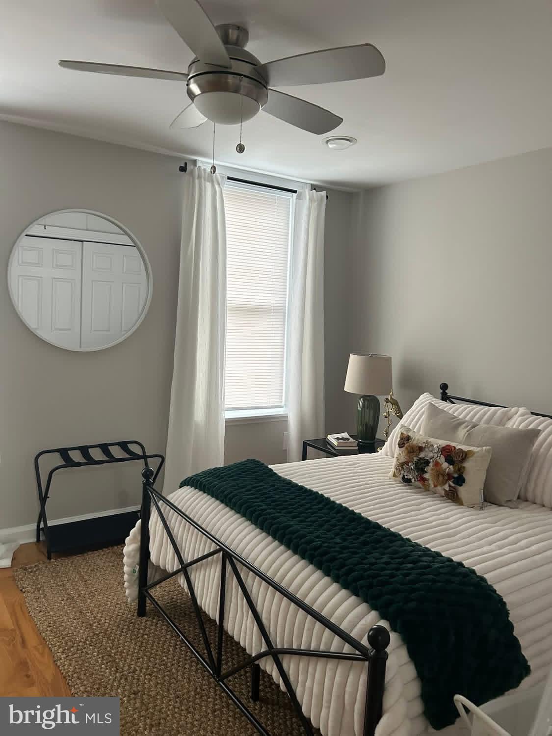 414 Durfor Street Philadelphia, PA 19148 - Photo 10 of 10 a bedroom with a bed a window and a chandelier