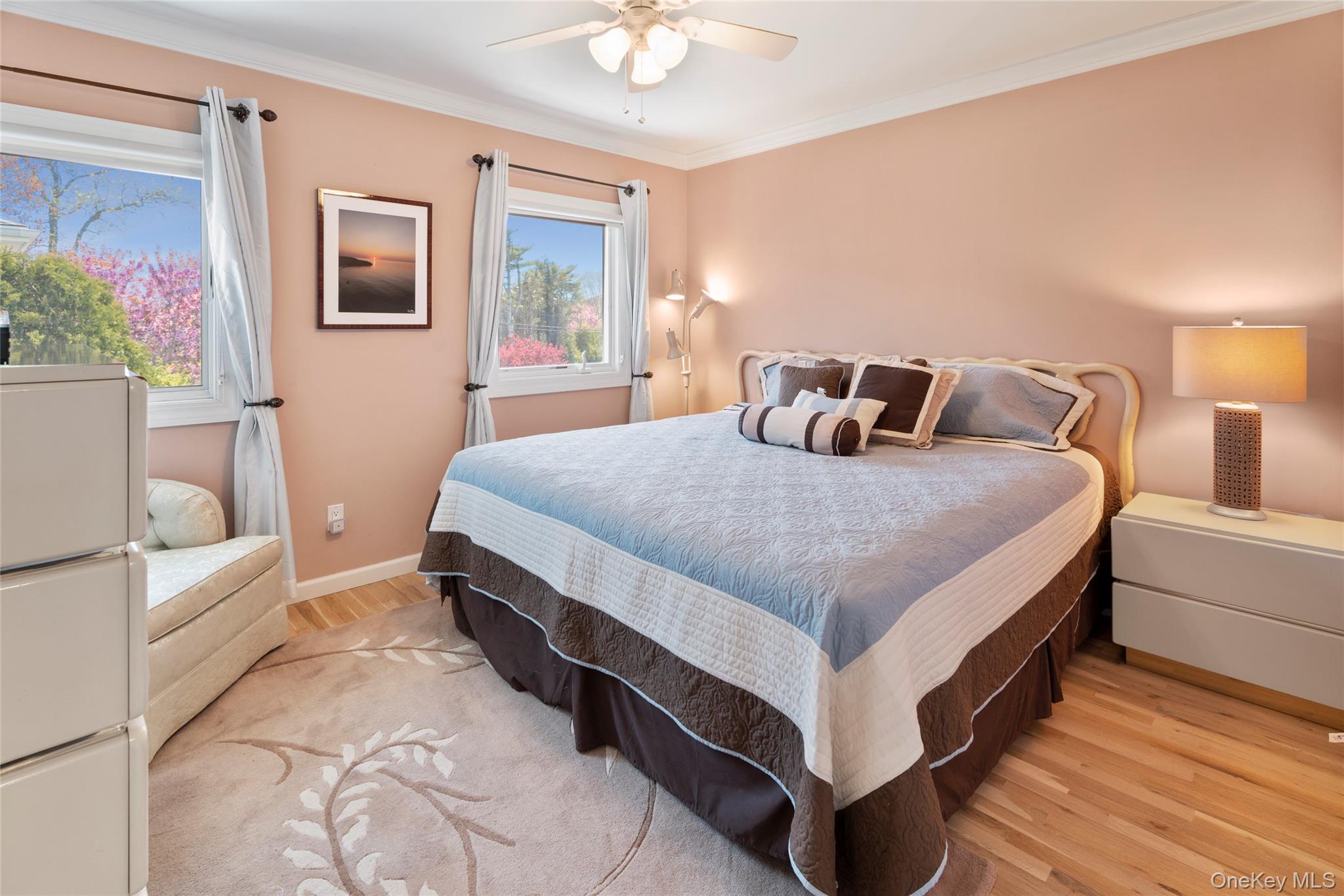 3012 Mitchell Road, Unit 3012 Westhampton Beach, NY 11978 - Photo 11 of 19 a bedroom with a bed and window