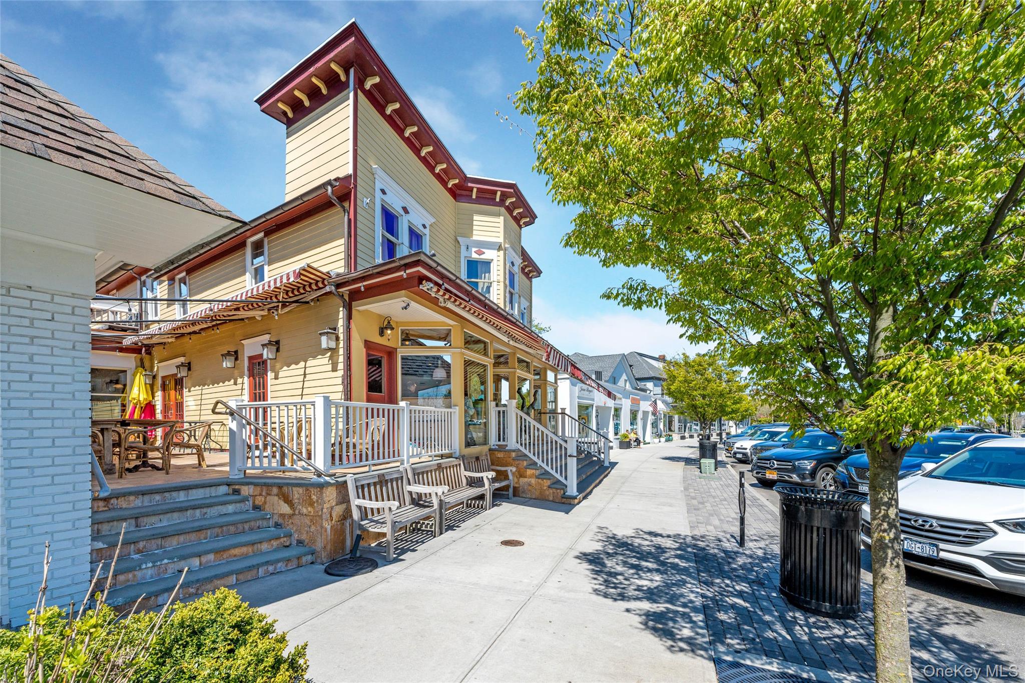 3012 Mitchell Road, Unit 3012 Westhampton Beach, NY 11978 - Photo 16 of 19 a front view of a house with a tree