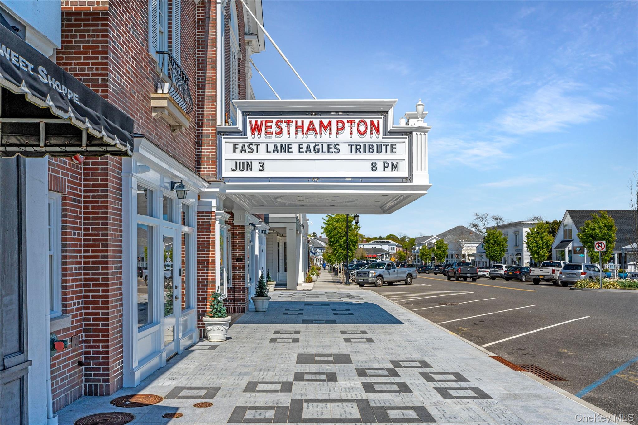 3012 Mitchell Road, Unit 3012 Westhampton Beach, NY 11978 - Photo 17 of 19 a view of a street with shops