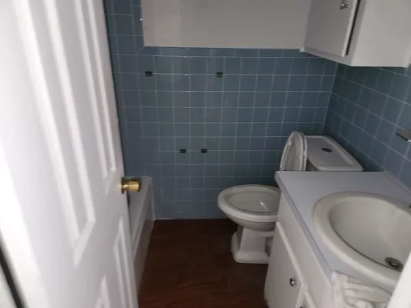 a bathroom with a toilet and a sink