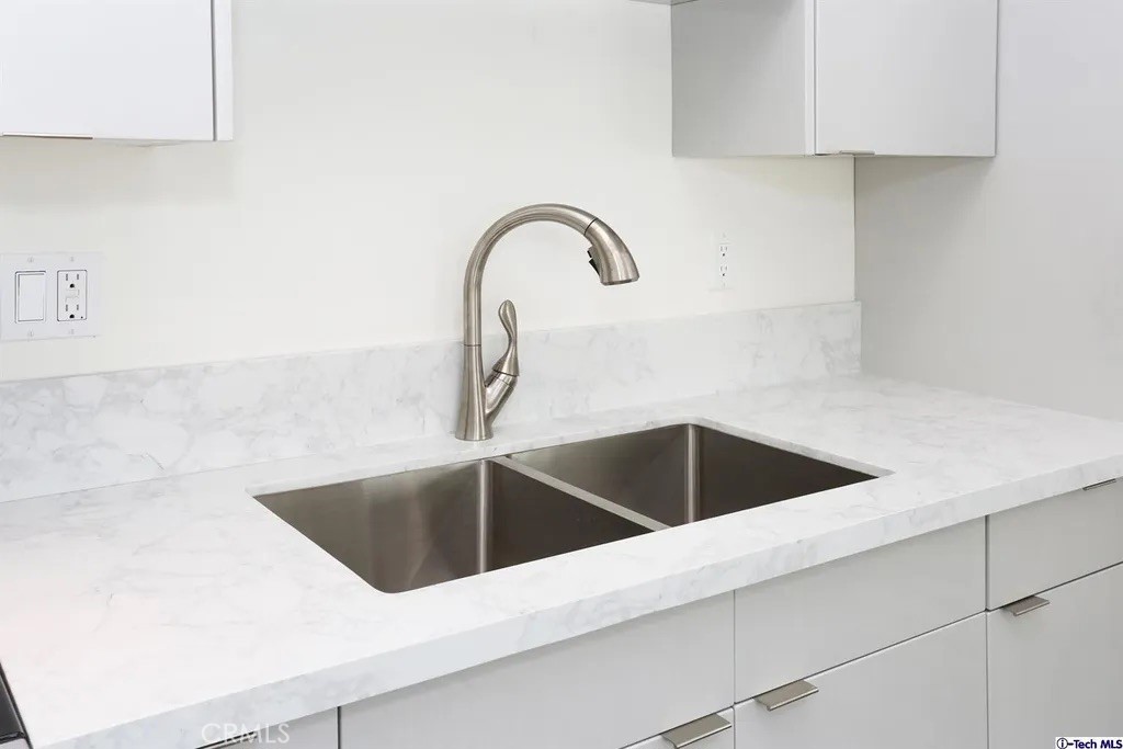 7521 Milwood Avenue Canoga Park, CA 91303 - Photo 9 of 15 a close view of sink and tap