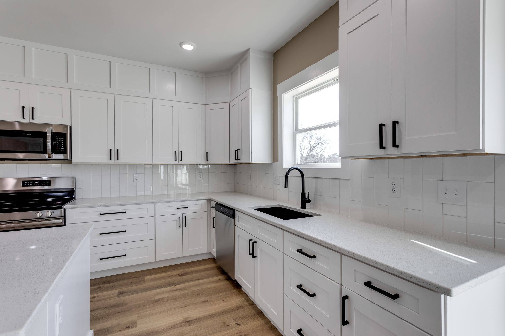 2259 Les Robinson Road Columbia, TN 38401 - Photo 12 of 31 a kitchen with granite countertop white cabinets white stainless steel appliances and sink