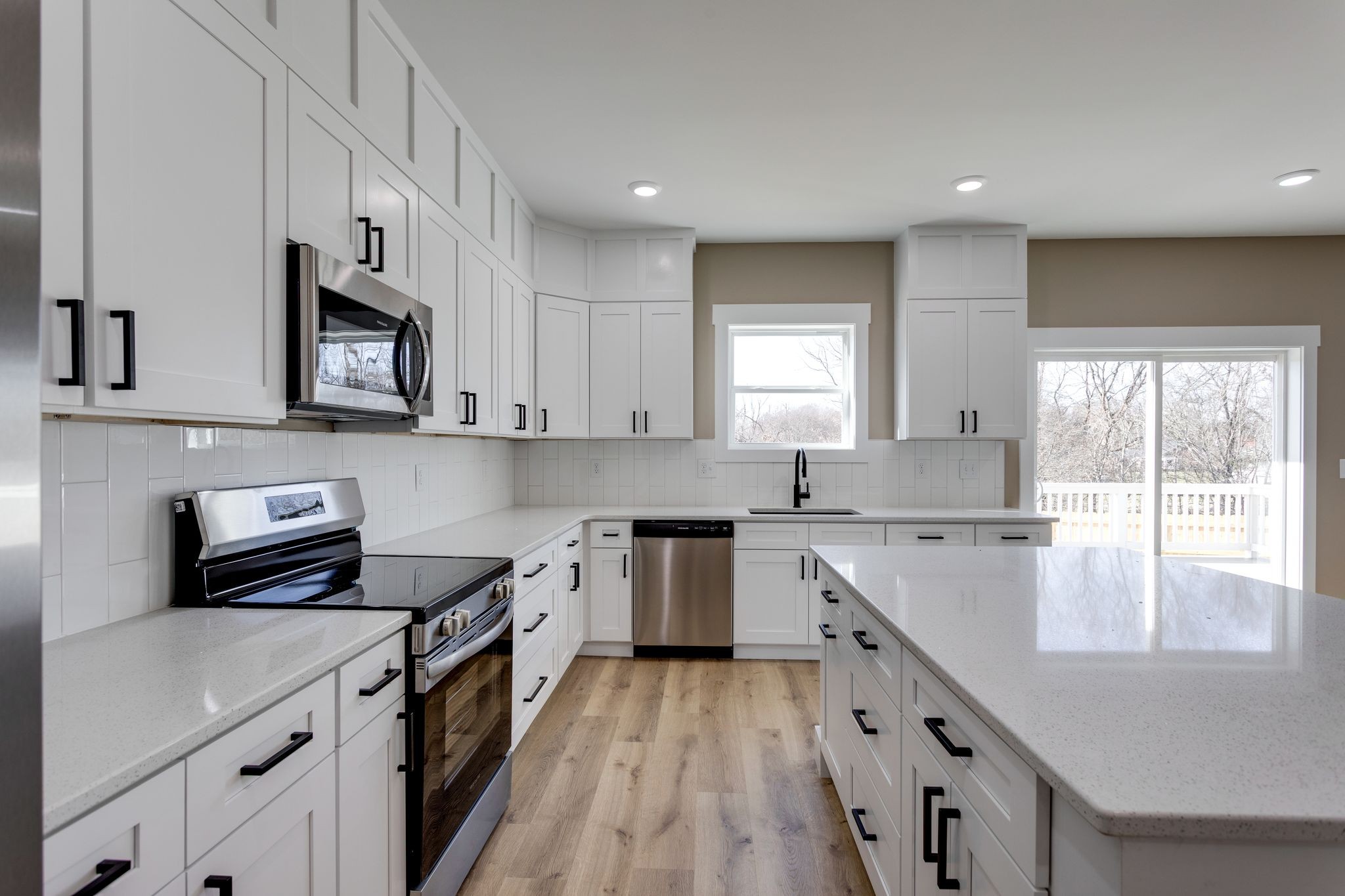 2259 Les Robinson Road Columbia, TN 38401 - Photo 13 of 31 a kitchen with stainless steel appliances granite countertop a stove a sink and a microwave