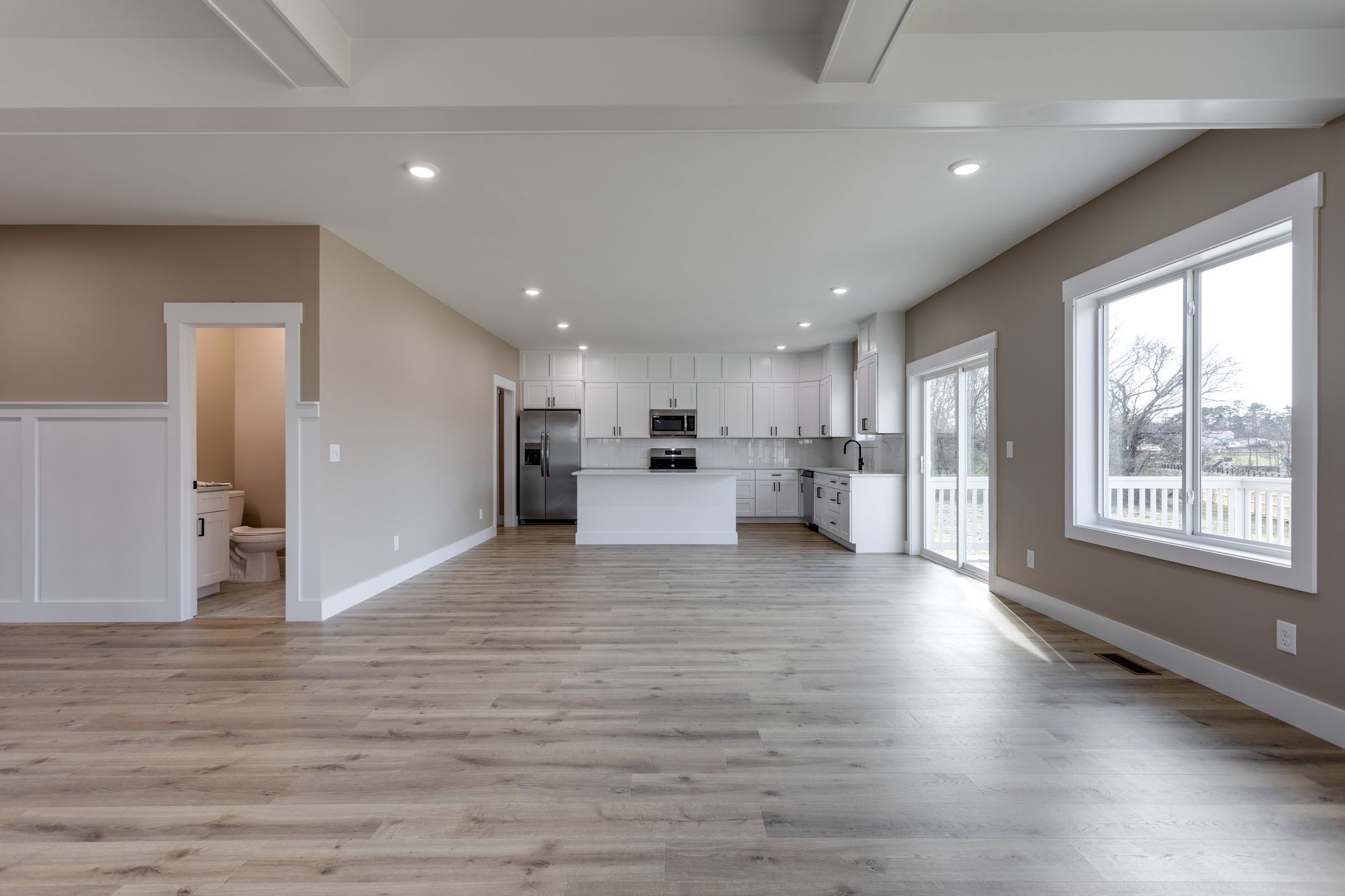 2259 Les Robinson Road Columbia, TN 38401 - Photo 14 of 31 a view of kitchen with kitchen island wooden floor and window