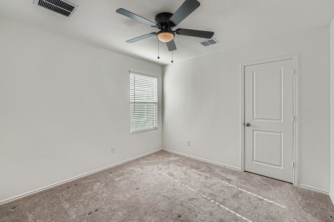210 Sormonne Loop Kyle, TX 78640 - Photo 13 of 17 a view of an empty room