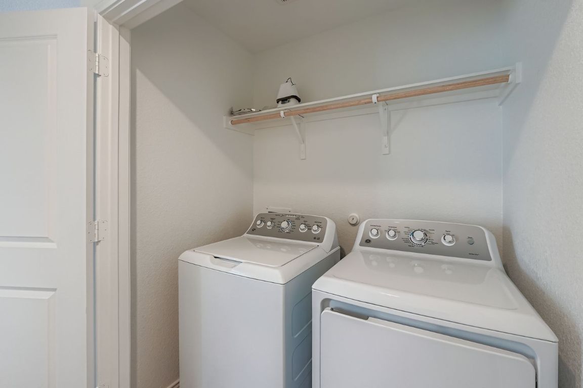 210 Sormonne Loop Kyle, TX 78640 - Photo 15 of 17 a utility room with dryer and washer
