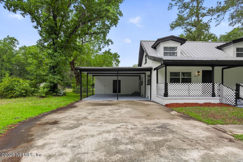 43739 Ratliff Road Callahan, FL 32011 - Photo 4 of 55 a front view of a house with garden