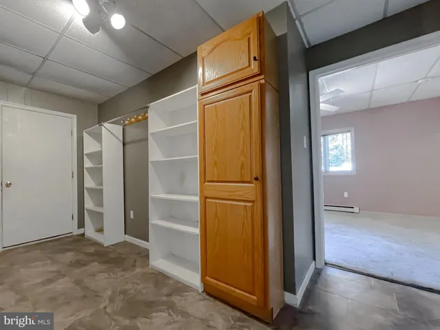 a view of an empty room with a window