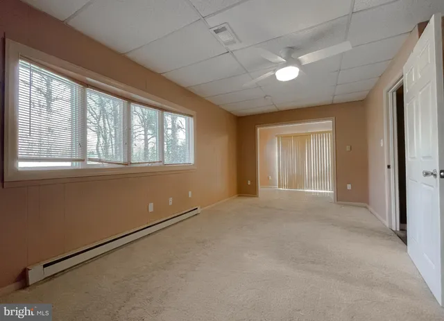 a view of a bathroom with a sink and a mirror