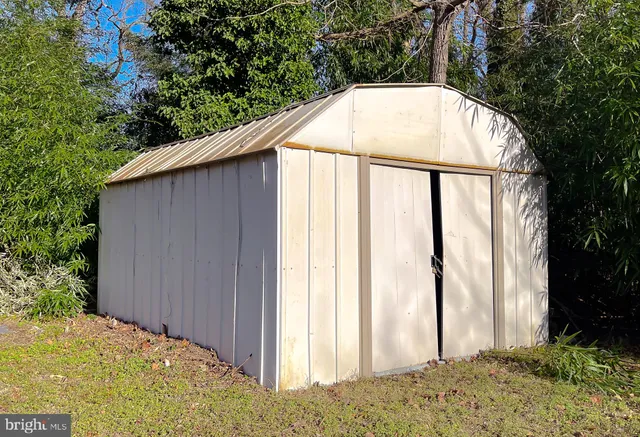 a view of a balcony with wooden floor and fence