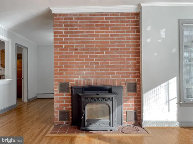 a view of fireplace and wooden floor